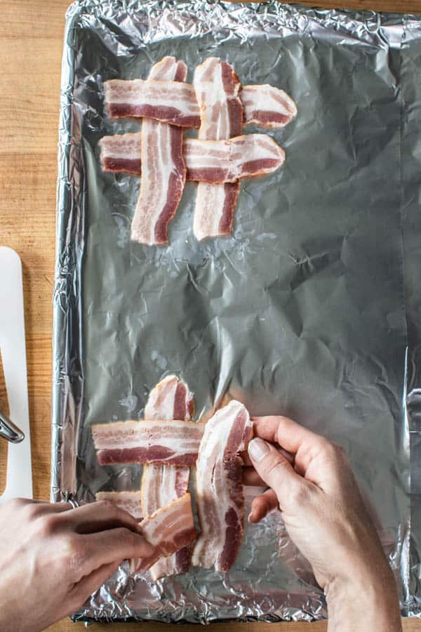Bacon weaves on a sheet pan for BLT sandwiches. 
