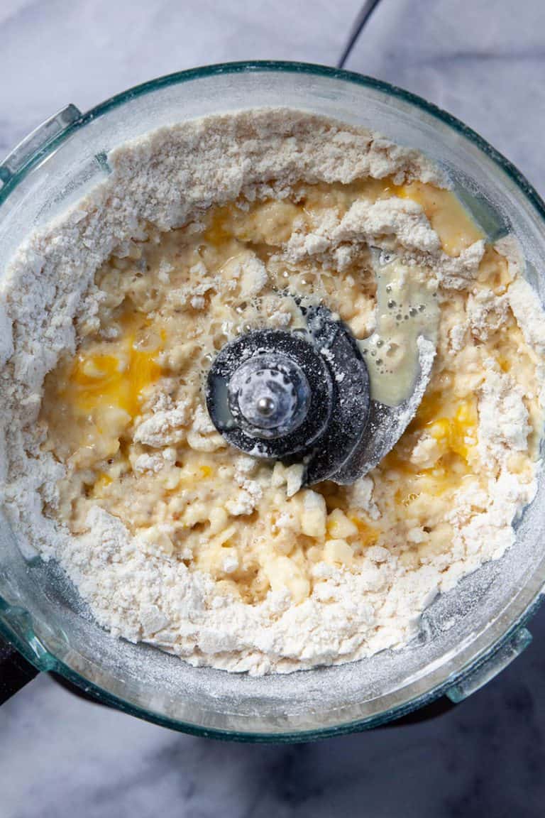 Liquids added into the food processor for tart recipe.