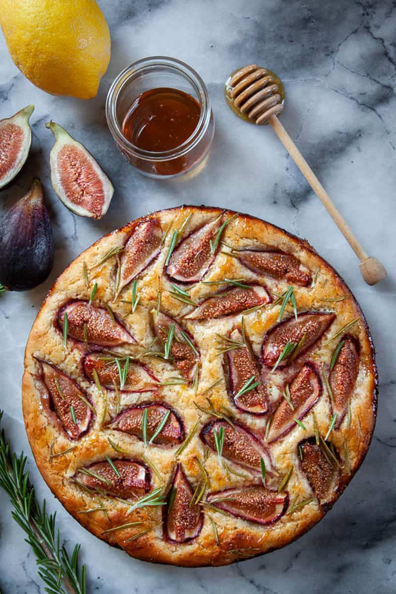 A round fig focaccia sprinkled with rosemary and drizzled with honey.