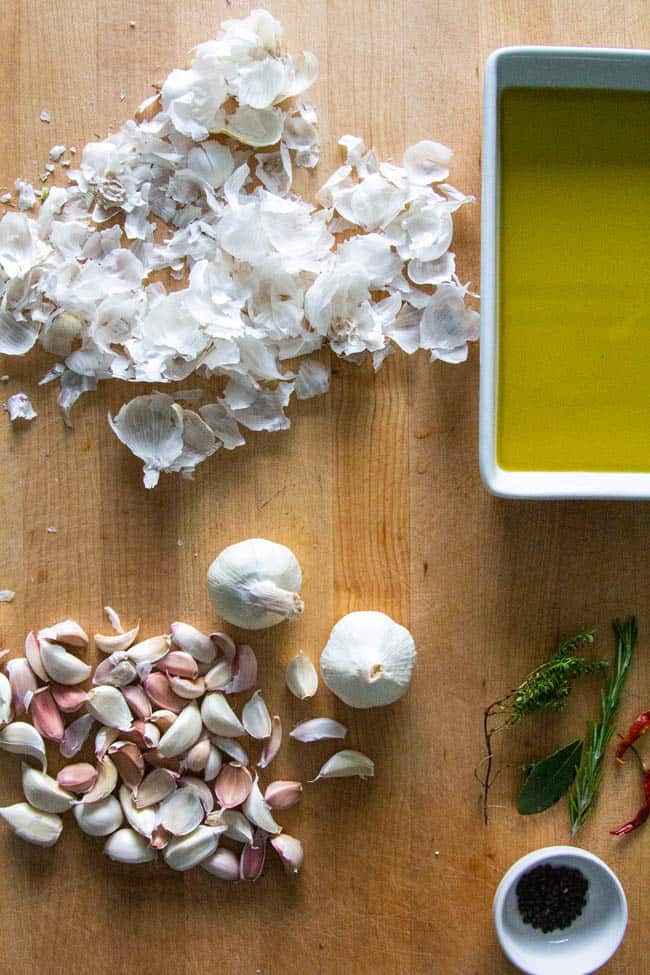 Cloves of garlic separated from the papery heads to make garlic confit.