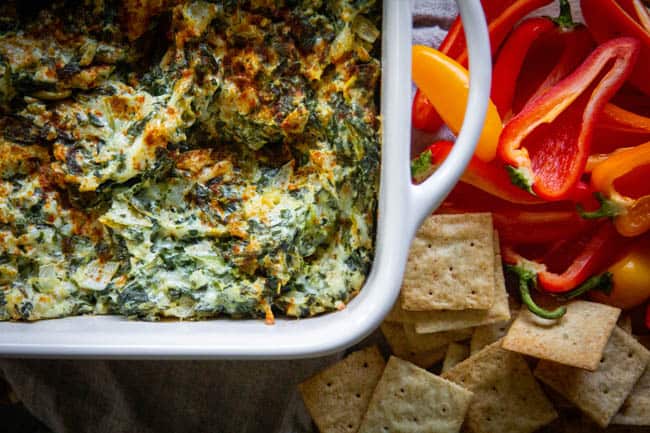 A pan of spinach artichoke dip. 