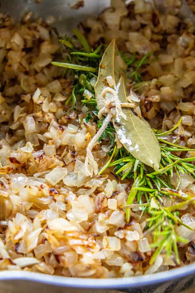 Ingredients to make sweet onion jam in a pan.