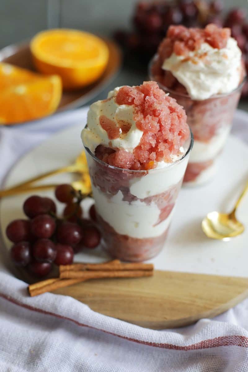 Spiced Grape Granita Parfait next to delicious grapes.