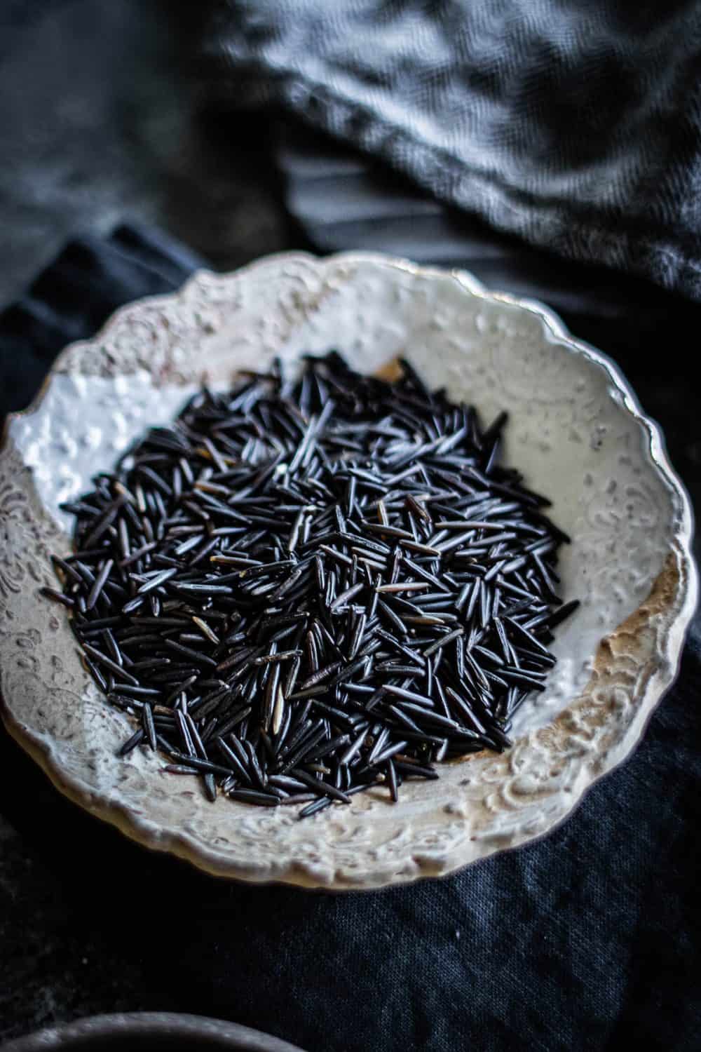 Uncooked wild rice in a bowl. 
