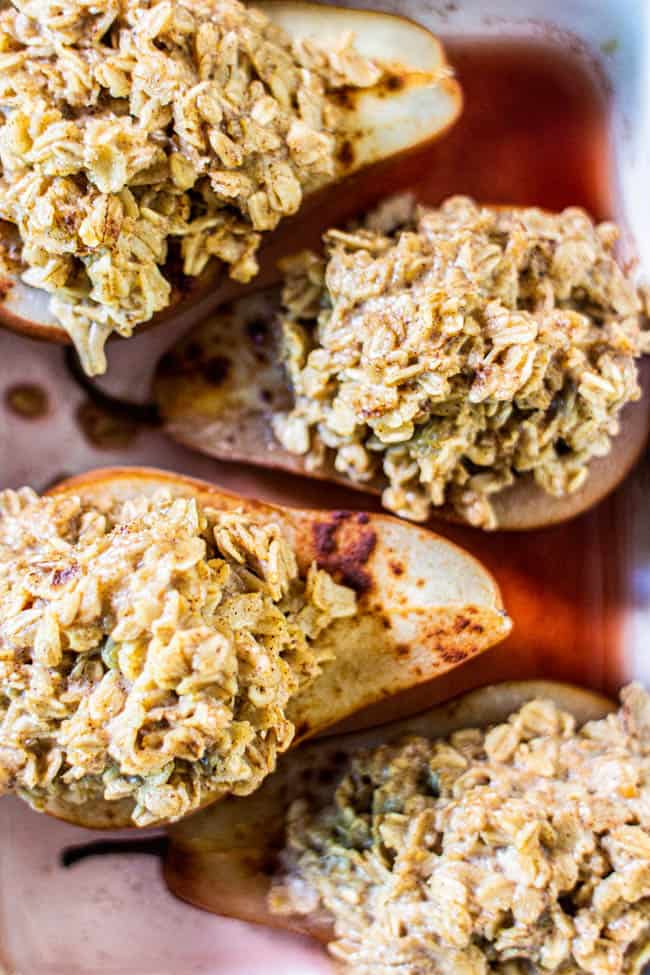 This Recipe for Baked Oatmeal Fig Stuffed Pears makes 4 stuffed pears. This image shows four of the finished pears in a baking dish.