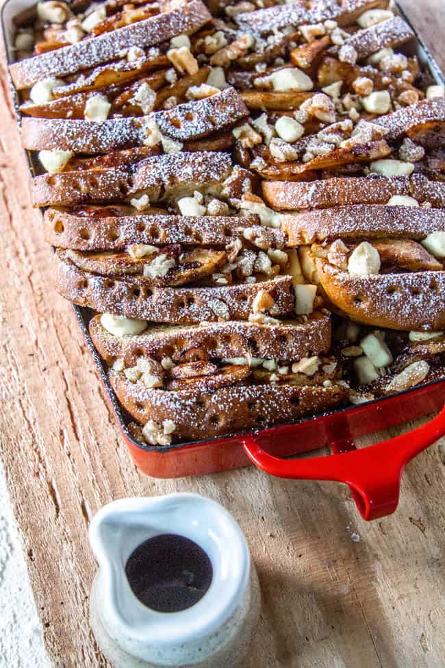 Baked French Toast with Apples recipe next to maple syrup.