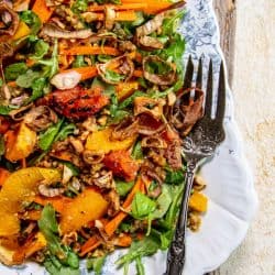 A Simple Holiday Salad with Citrus and Toasted Walnut Vinaigrette and crispy shallots.
