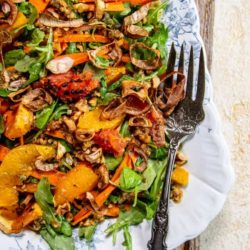 A Simple Holiday Salad with Citrus and Toasted Walnut Vinaigrette and crispy shallots.