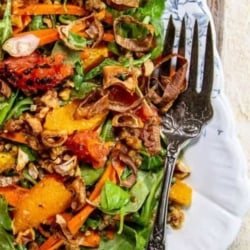 A Simple Holiday Salad with Citrus and Toasted Walnut Vinaigrette and crispy shallots.