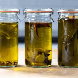 Three bottles of infused olive oil.
