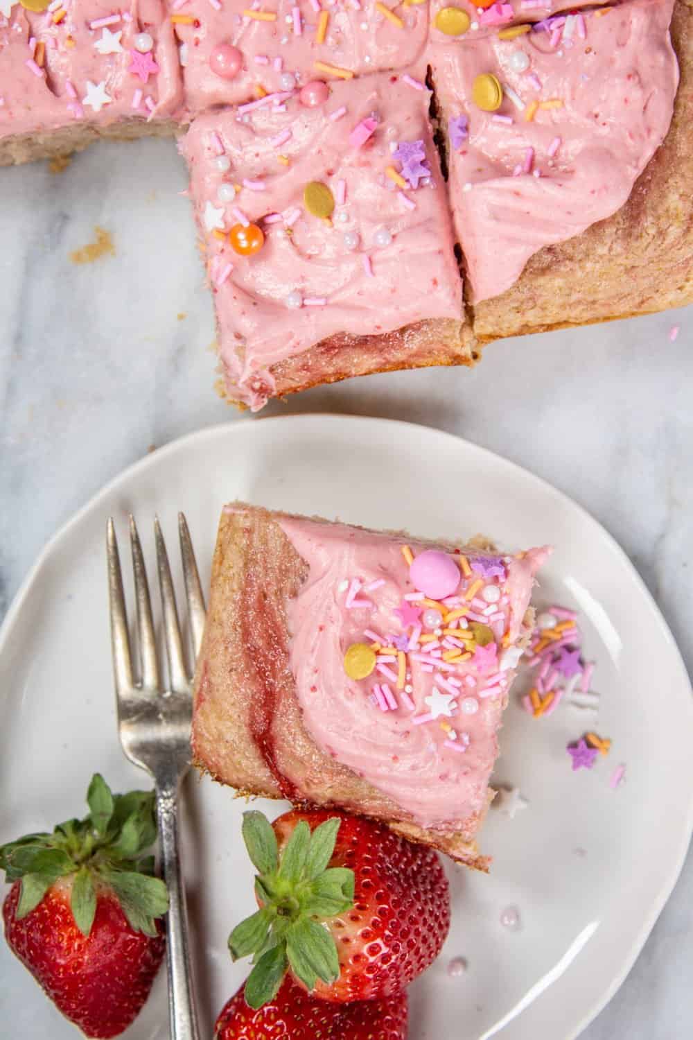 Strawberry Rosé Snack Cake cut into squares to serve.