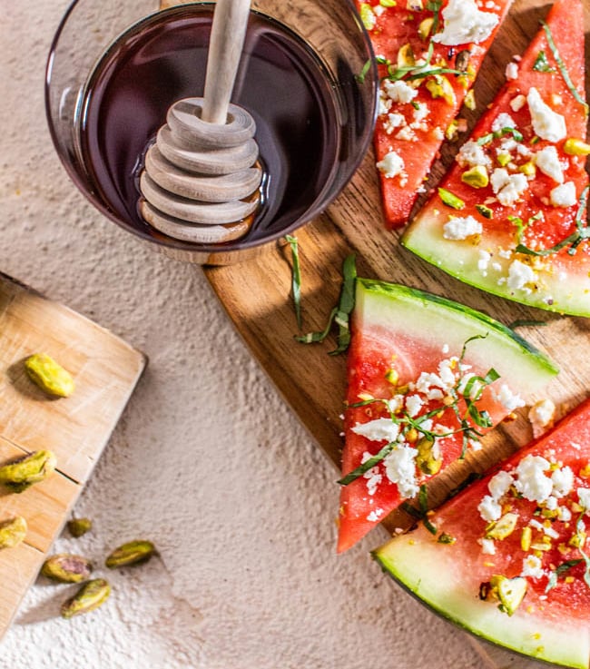 A Fruit-Forward Easy Appetizers Party Round-up and Pistachio, Hot Honey & Basil Watermelon Wedges.