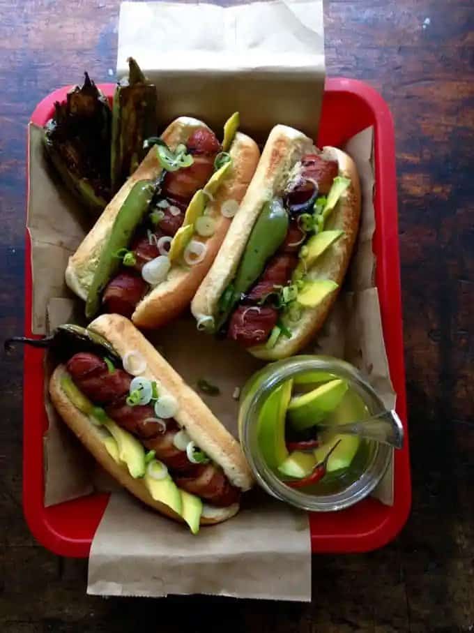 Bacon Wrapped Hot Dogs with Avocado Pickles