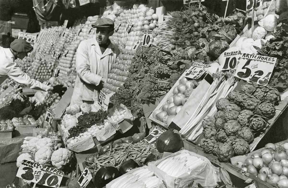 Artichokes being sold at an open air market in NYC 1934