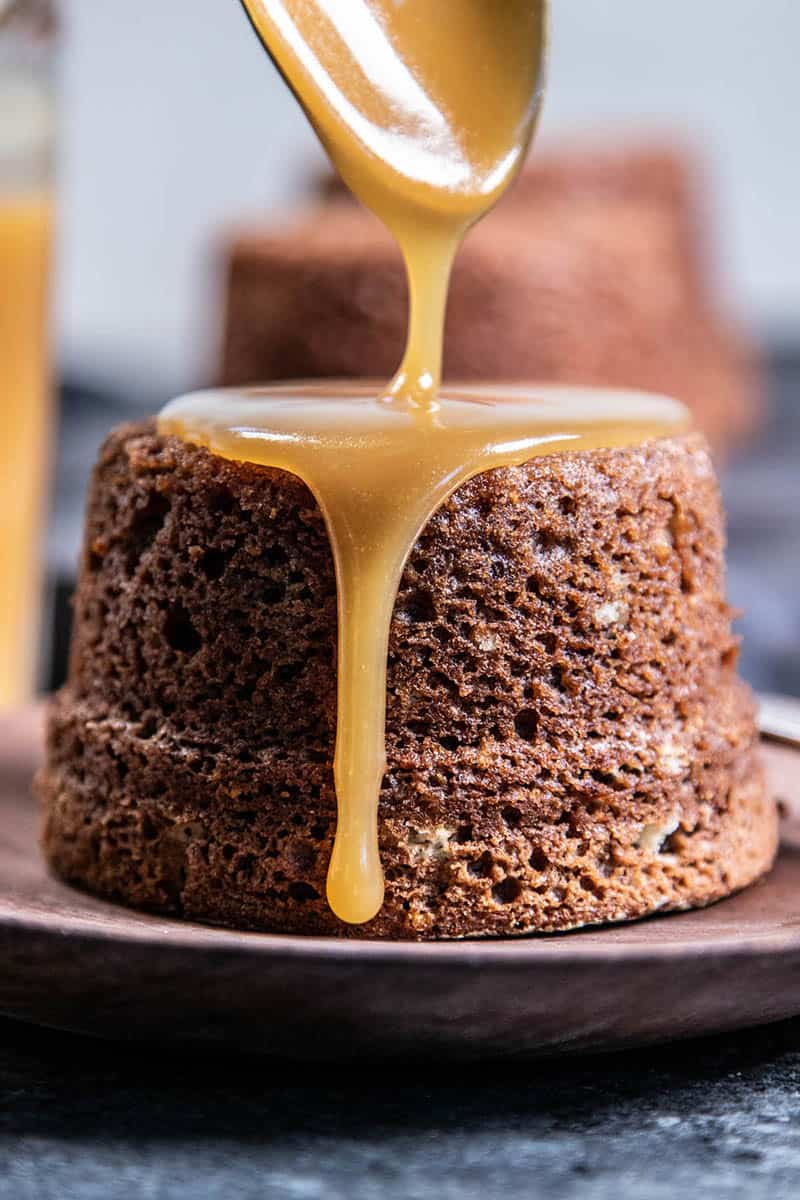 A figgy pudding being drizzled with caramel.