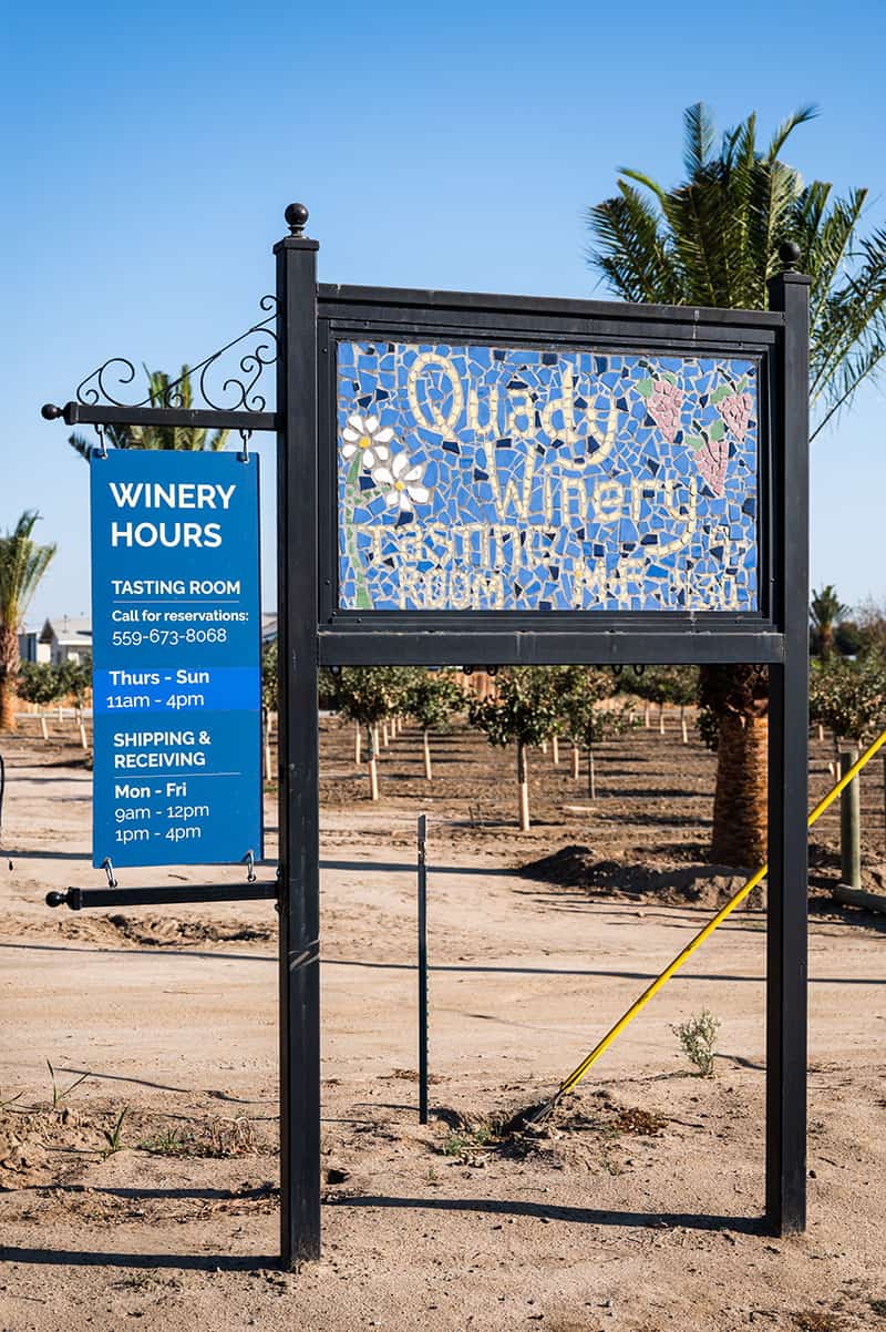 A sign for the tasting room at Quady winery.