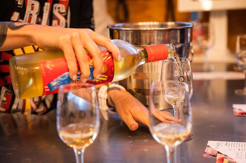 Wine being poured into a tasting glass.