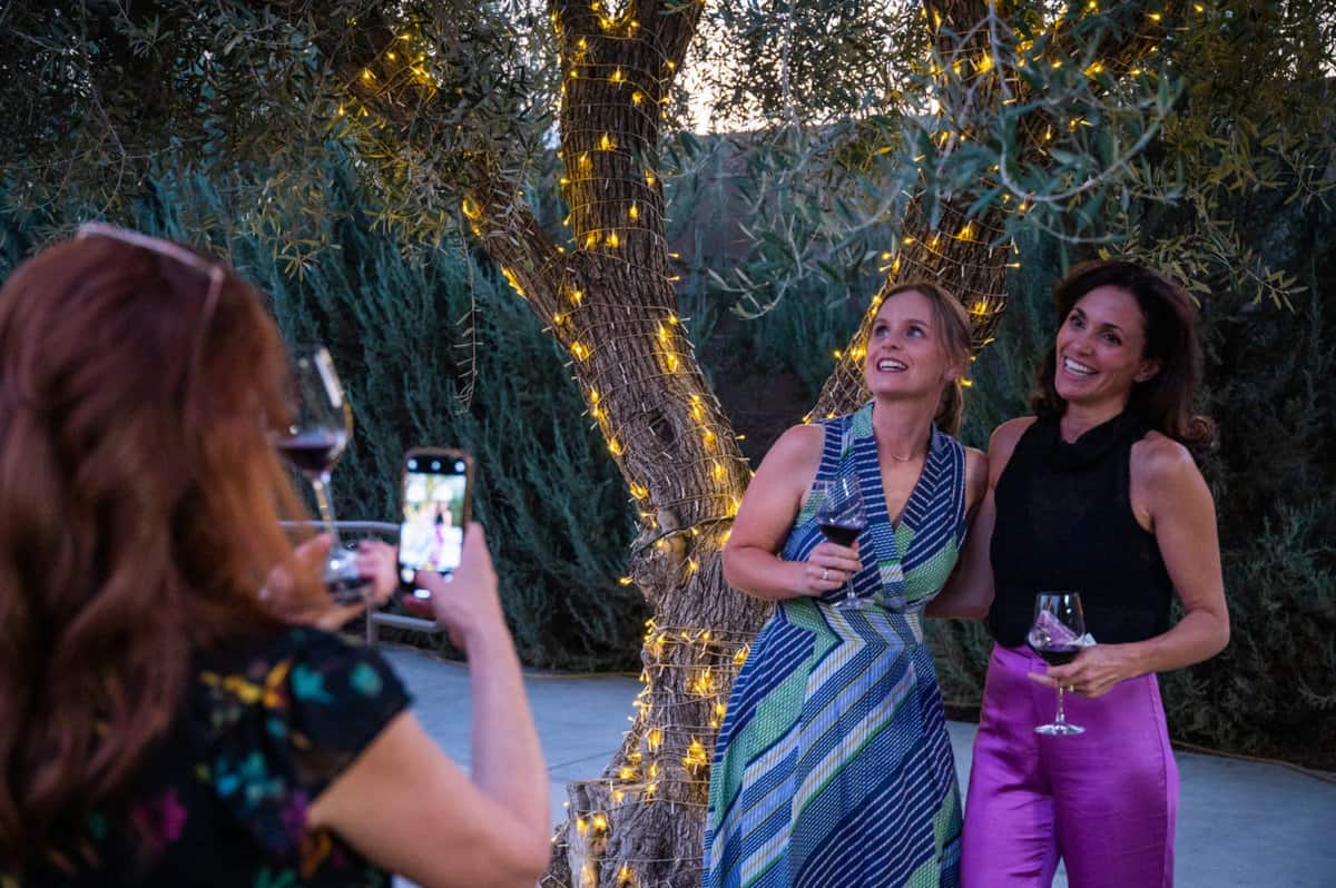 Aida Mollenkamp and Kate Ramos posing in the courtyard of San Joaquin Winery