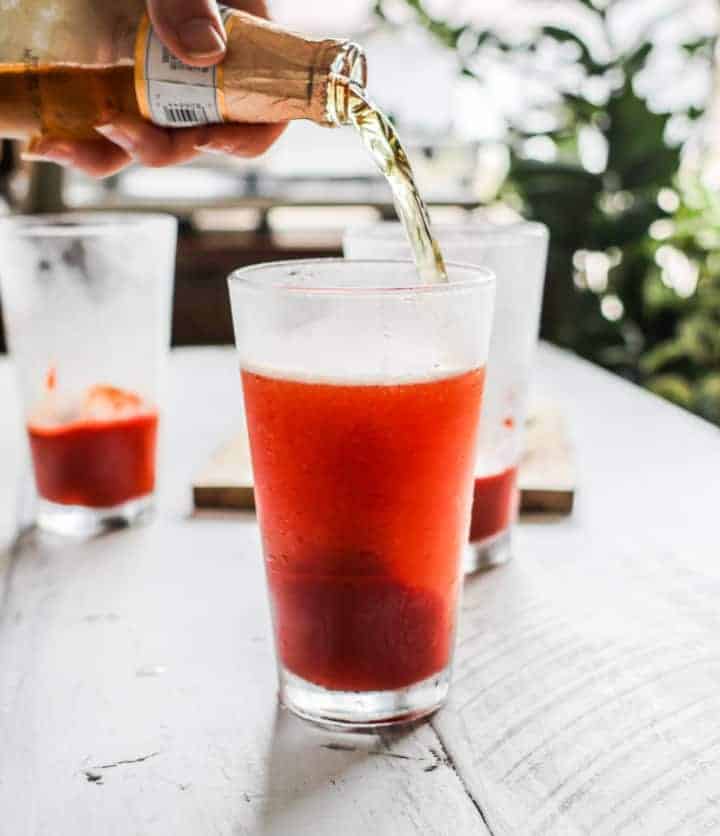 red beer from G-Free foodie garnished with jarred pepper