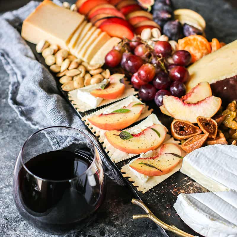 Happy Hour at Home peach/Camembert/basil/black pepper on flatbread crackers, Cabernet Sauvignon, CA Grown 