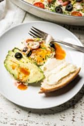 avocado and baked eggs with hot sauce