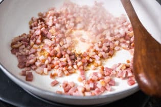 Cooking bacon over a stover top for Santa maria style beans - they're better than your baked beans recipes.