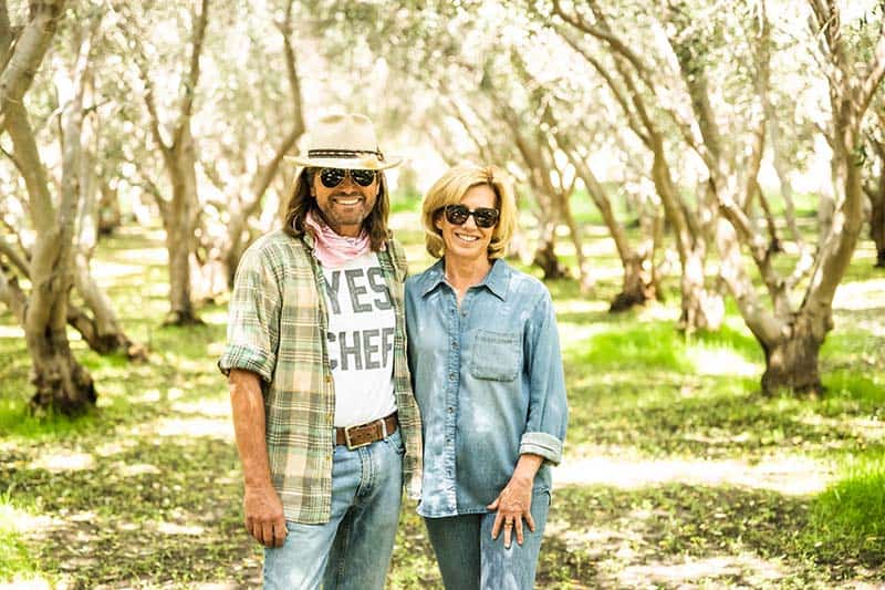 Thom and Nancy Curry in their olive grove.