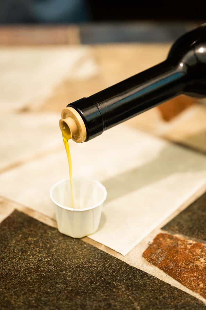 Olive oil being poured for a tasting.