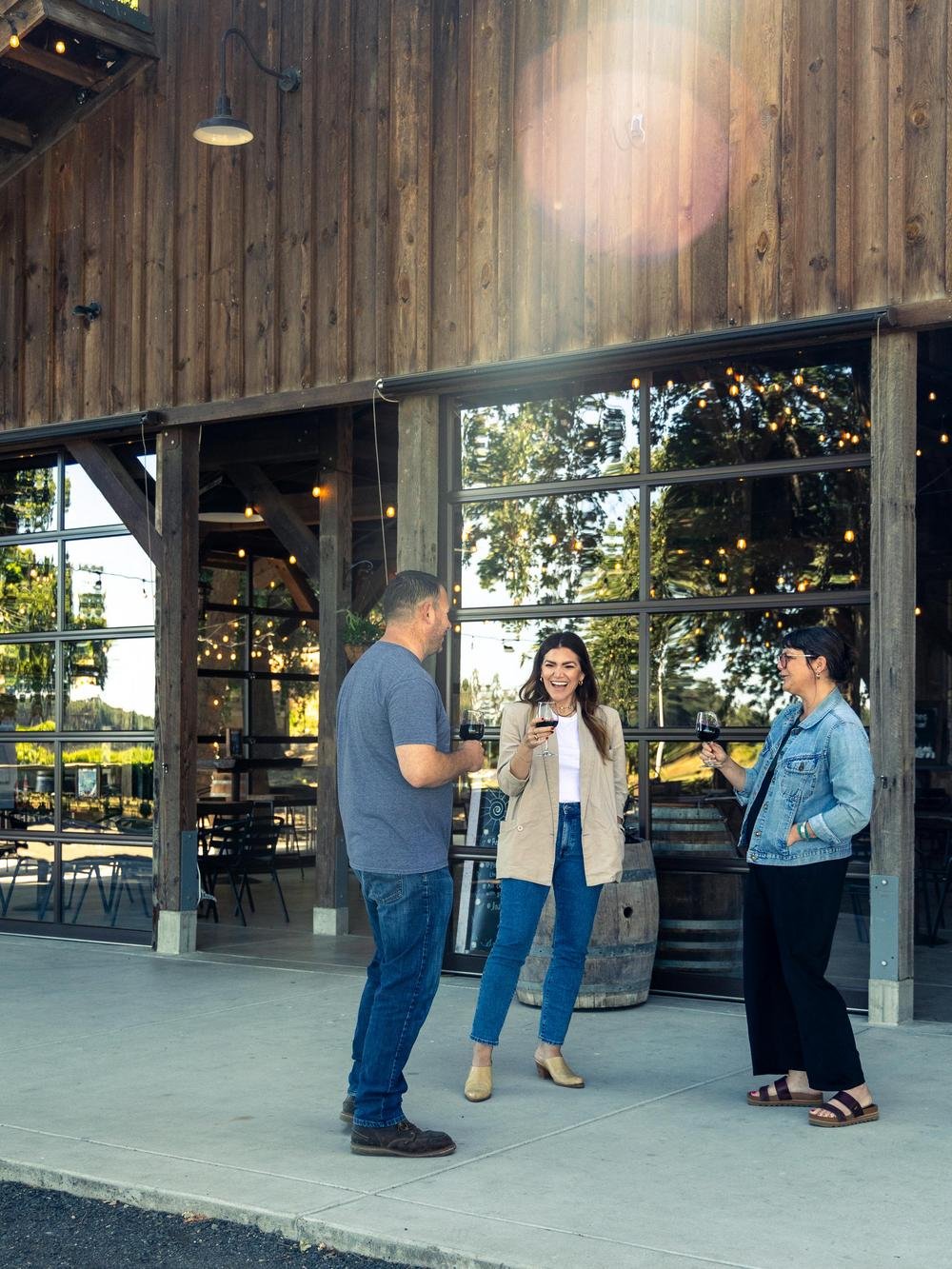 
Mike Heringer and guests chatting and wine tasting in the new tasting room.