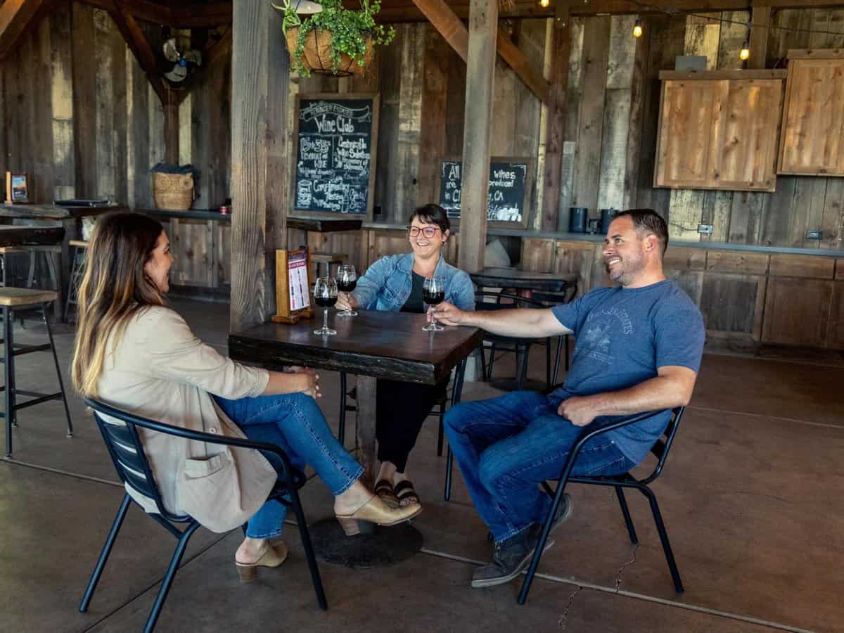 Mike Heringer and guests chatting and wine tasting in the new tasting room.