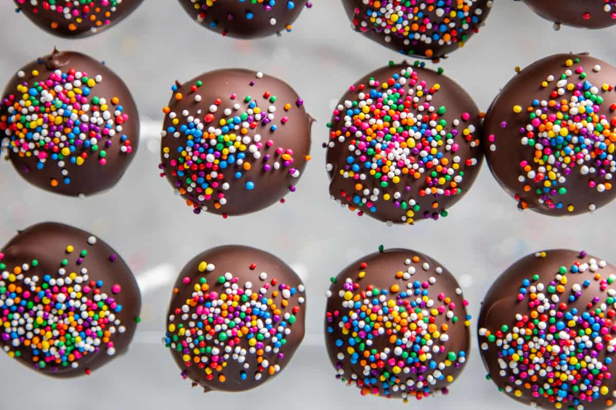 L:ooking down at the tops of sprinkled cake pops