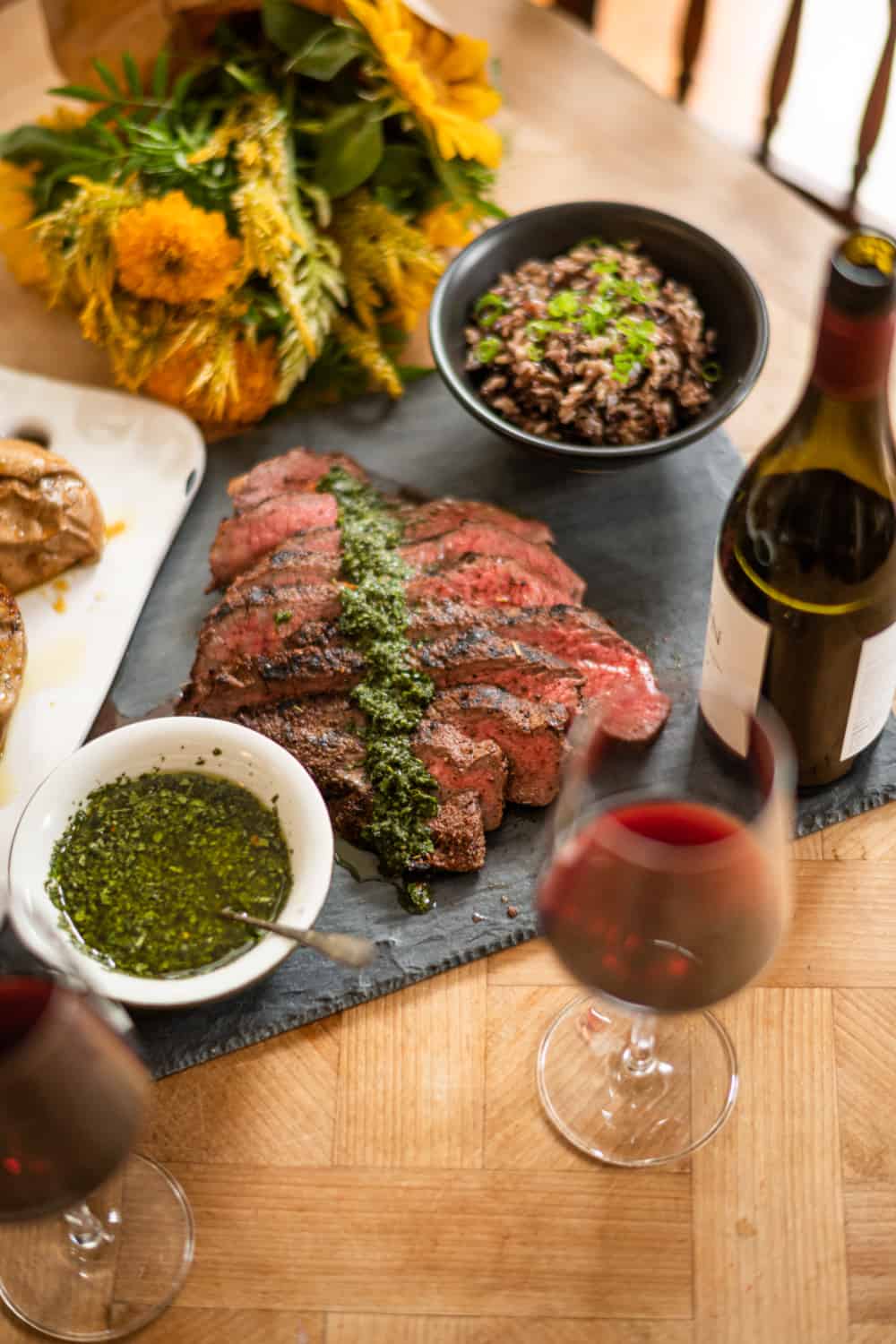 Santa Maria-style Tri Tip paired with red wine | Grilled tri tip with fresh herb chimichurri, roasted sweet potatoes and wild rice | paired with Zinfandel and Cabernet Sauvignon