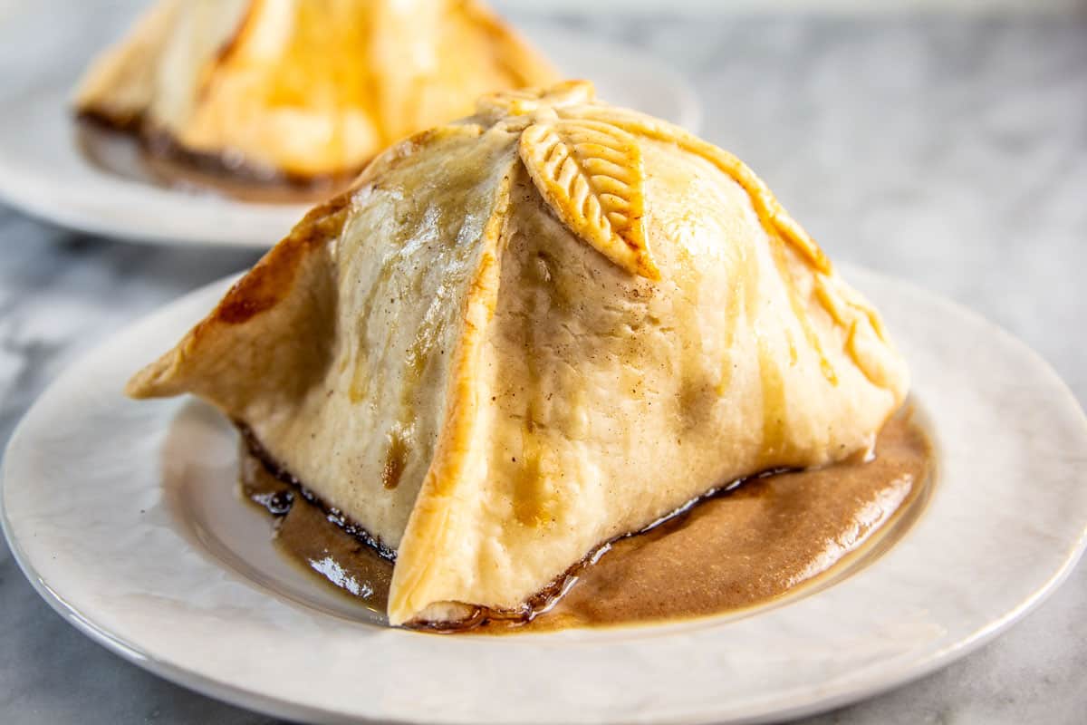 Apple dumpling plated on caramel.