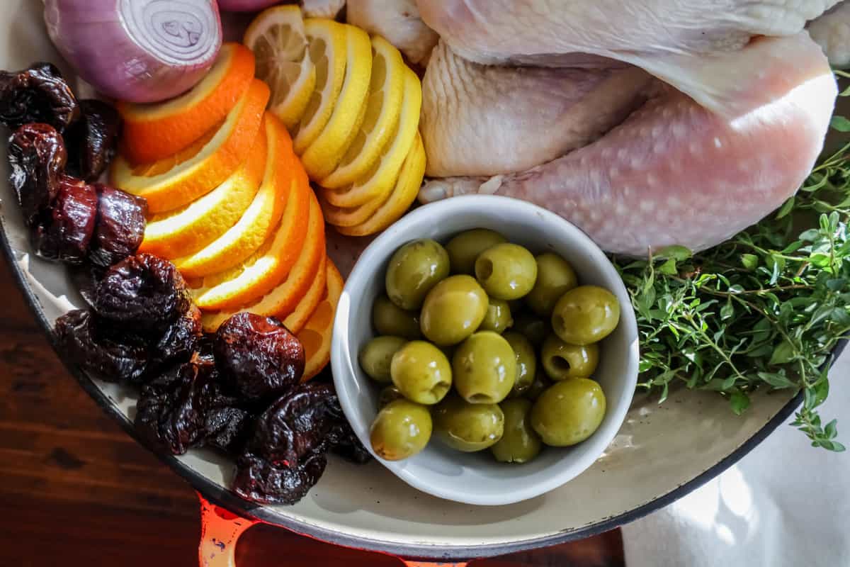 raw ingredients for roasted chicken with citrus and olives