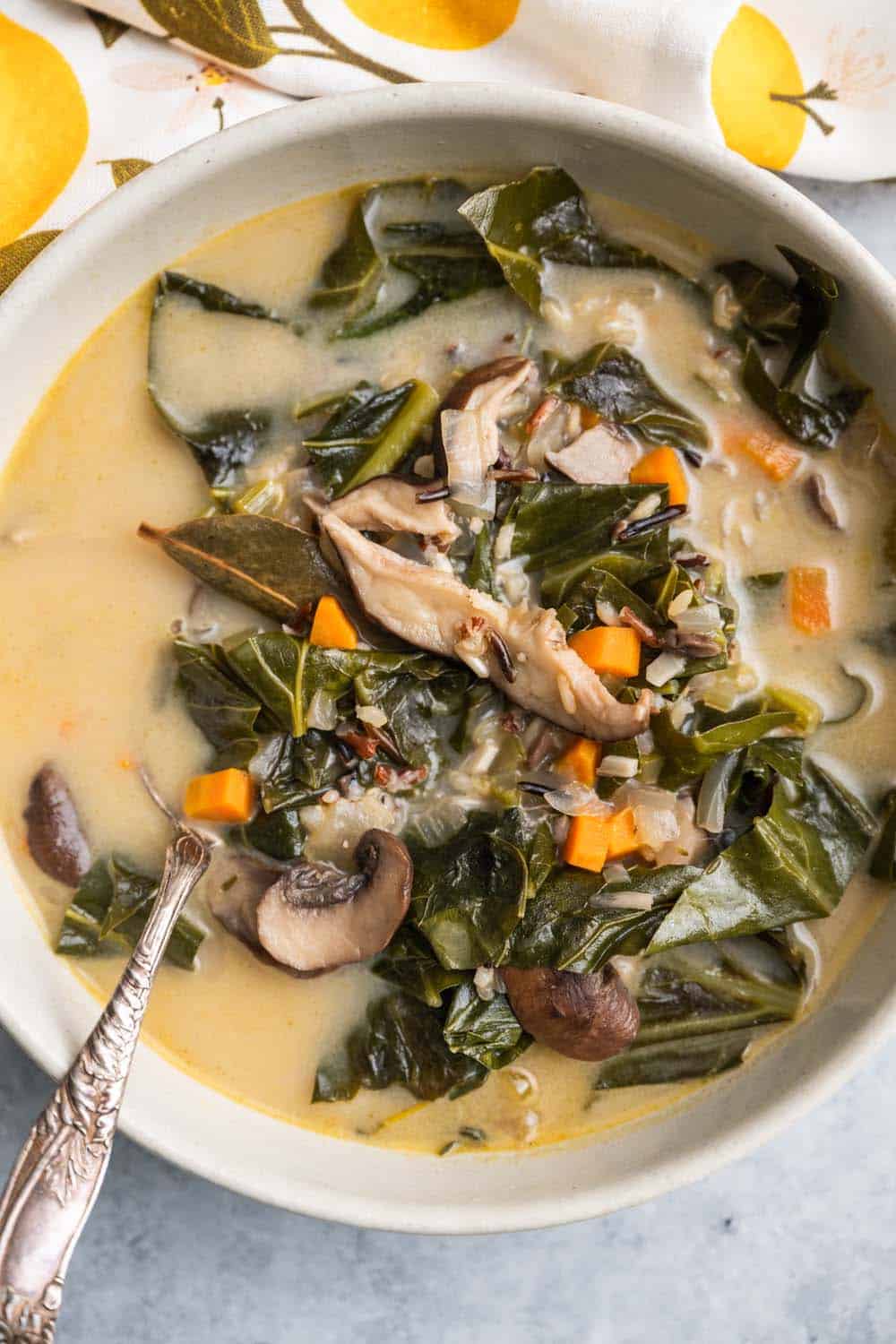 Close up of A Simple Collard Green and Wild Rice Soup with Mushrooms.