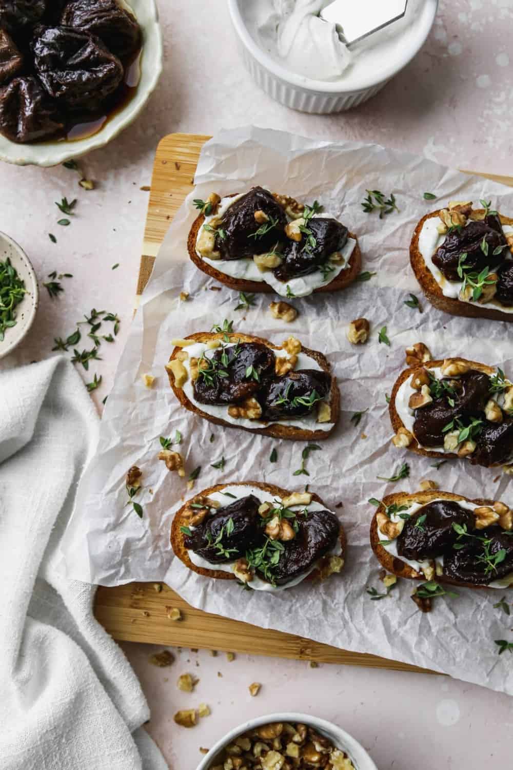 whipped goat cheese and stewed prunes on crostini bread