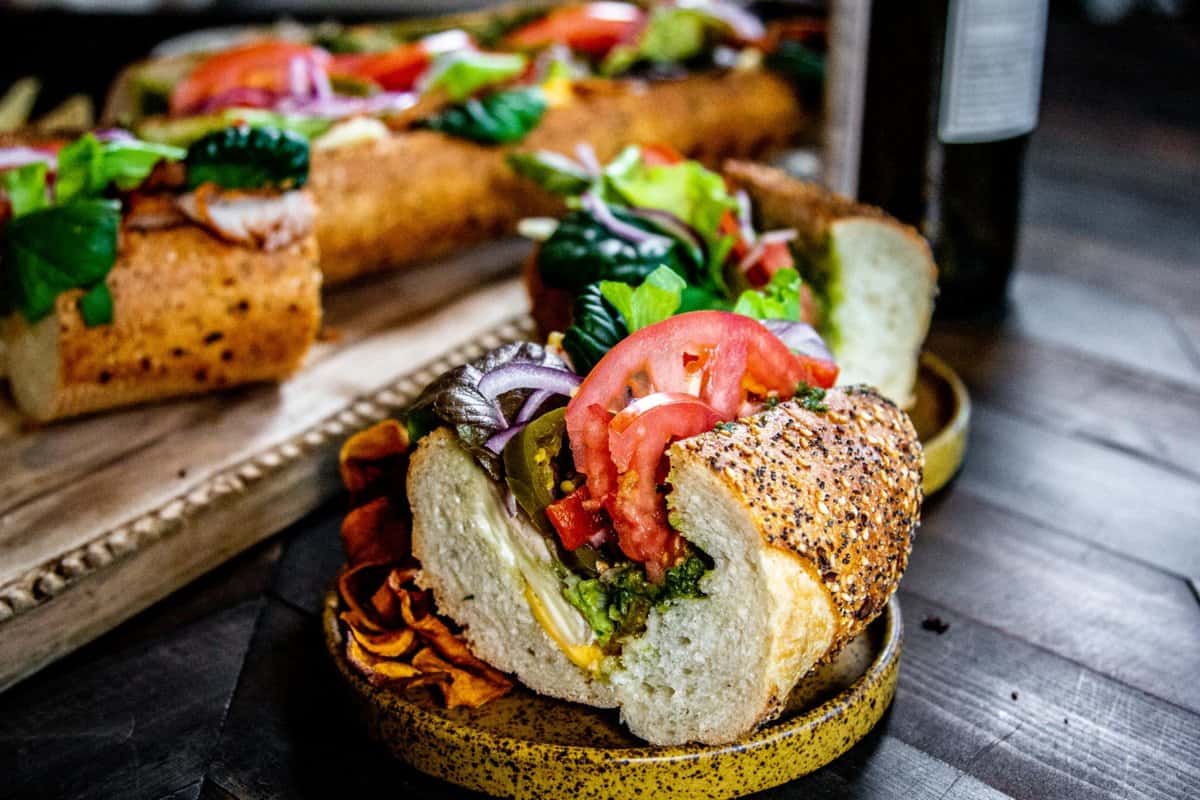 The Ultimate California Hoagie Sandwich for Game Day, 
w/ Teri’s Mayo and red wine
Ultimate Game Day California Club recipe || Leafy greens, pistachio basil pesto, olive oil, No Crumb's Left mayo with prunes, red wine, tomato, roasted red bell pepper, turkey, cheese, dairy, jalapeño, bacon, red onion