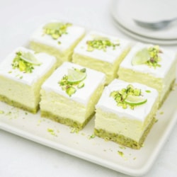 six slices of Lime Cheesecake with Pistachio Crust on a plate. recipe from the cookbook Pistachios: Sweet and Savory
