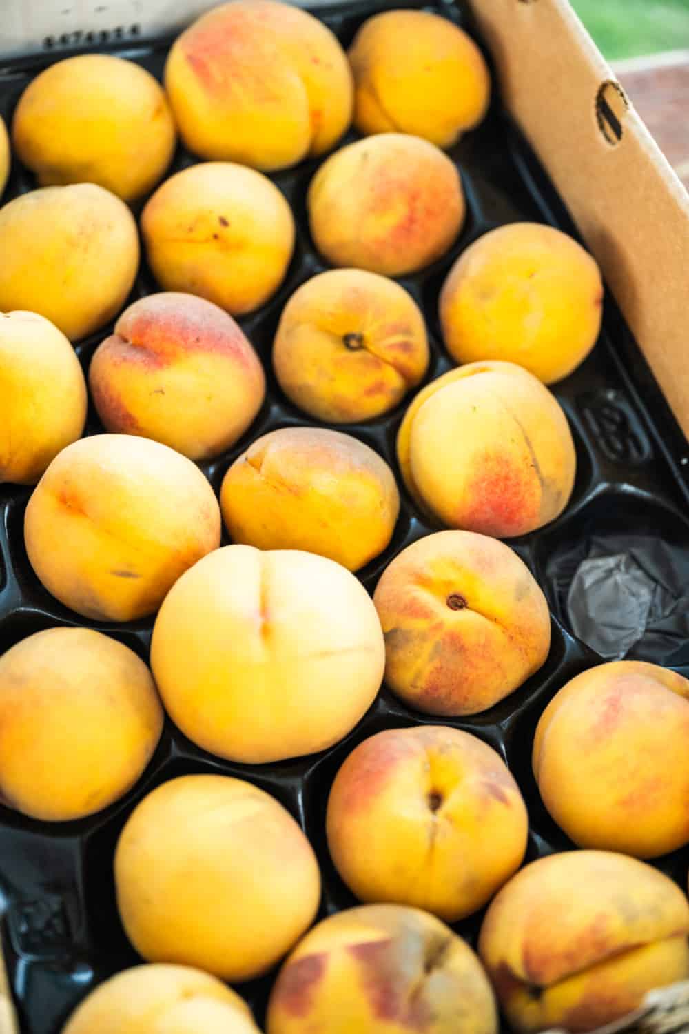 stone fruit in a tray at Vineyard Farmers Market