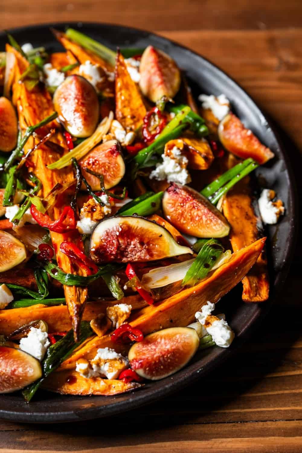 Roasted Sweet Potatoes with Scallions, Fresno Chili and Figs - close up image on plat