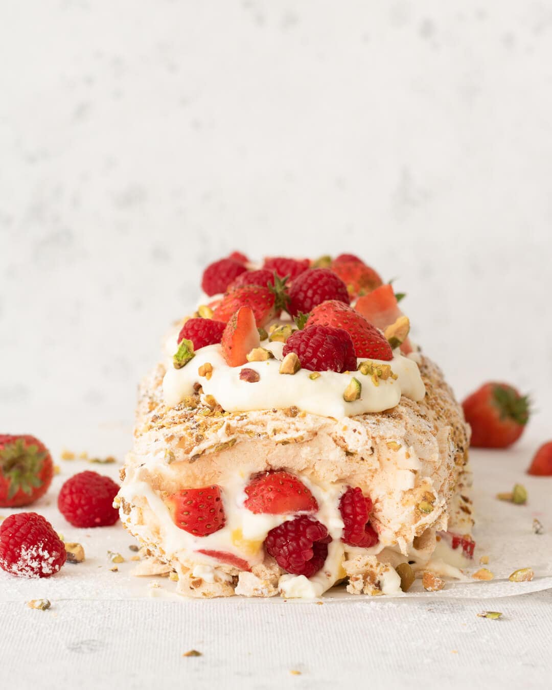 berry filled meringue roll cake