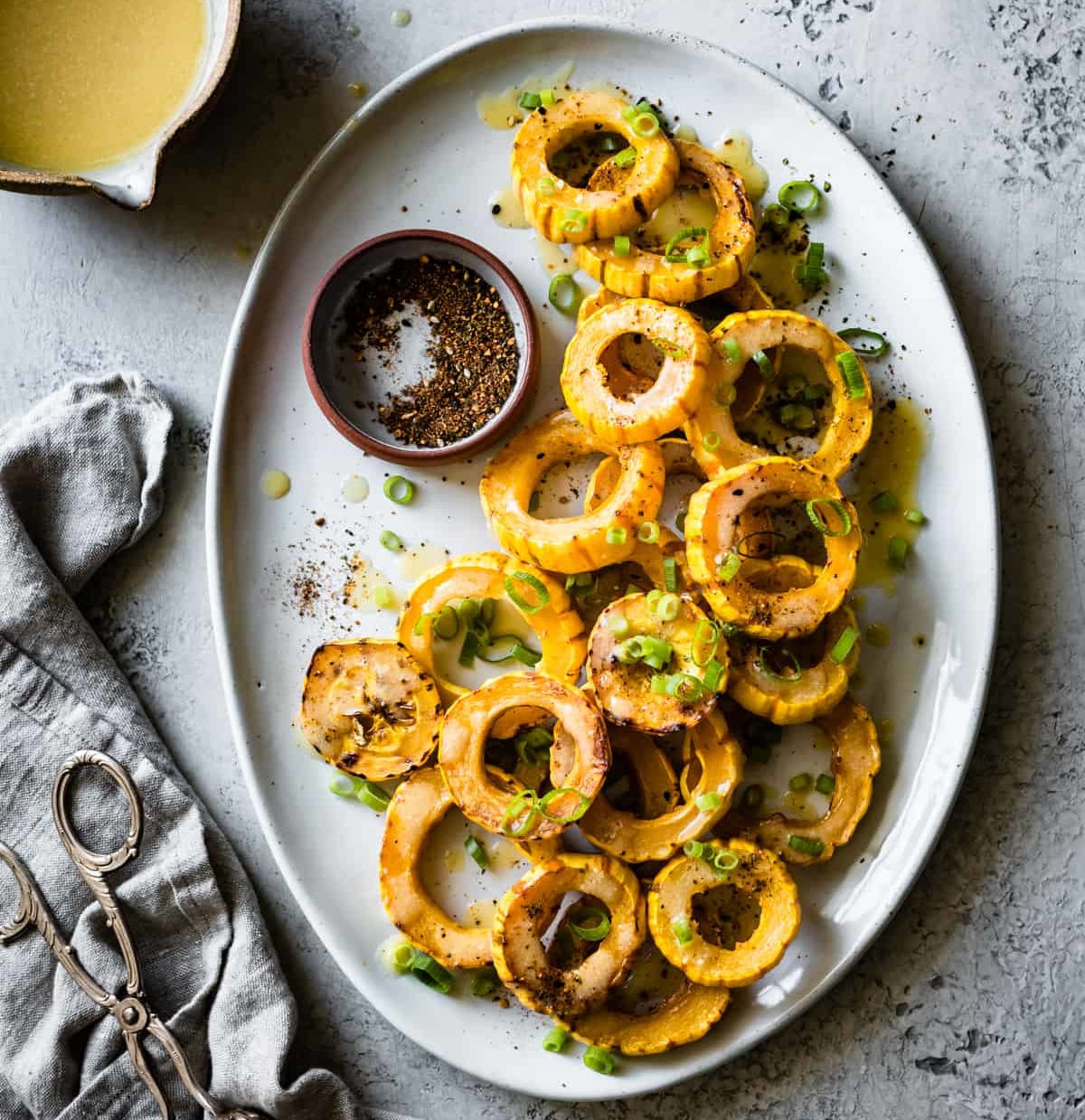 a plate of roasted delicata squash with miso butter from The Bojon Gourmet