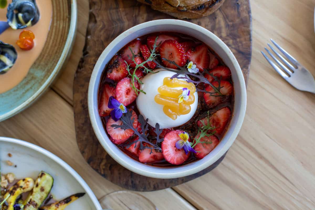 a strawberry and burrata dish from In Bloom restaurant