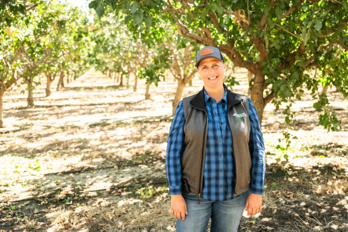 Hilary Nielsen Porter, of ENE Enterprises in one of the orchards that her family's business is harvesting