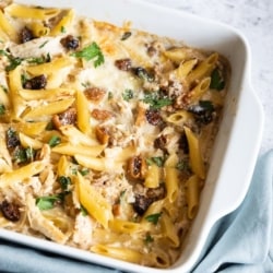 Creamy Baked Penne with Chicken, Dried Figs and Walnuts in a casserole dish