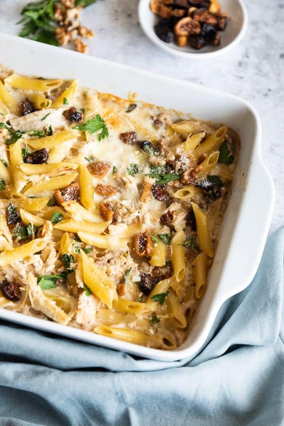 Creamy Baked Penne with Chicken, Dried Figs and Walnuts in a casserole dish