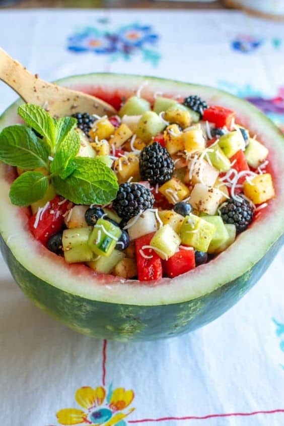 colorful Mexican fruit salad in a watermelon bowl - by Hola Jalapeno, berry recipes