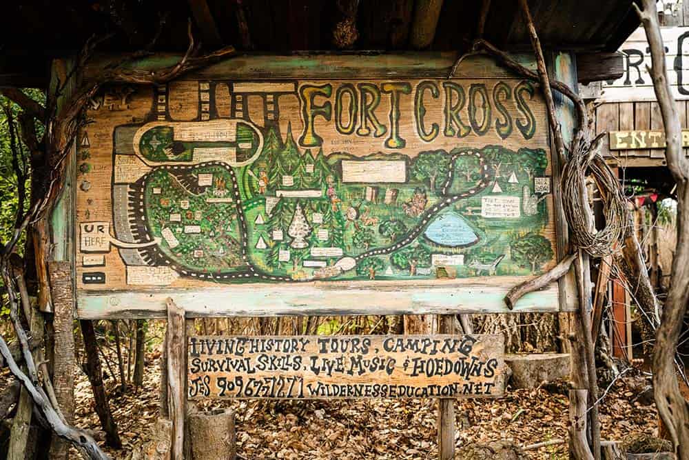 A hand painted sign of a map of Fort Cross.