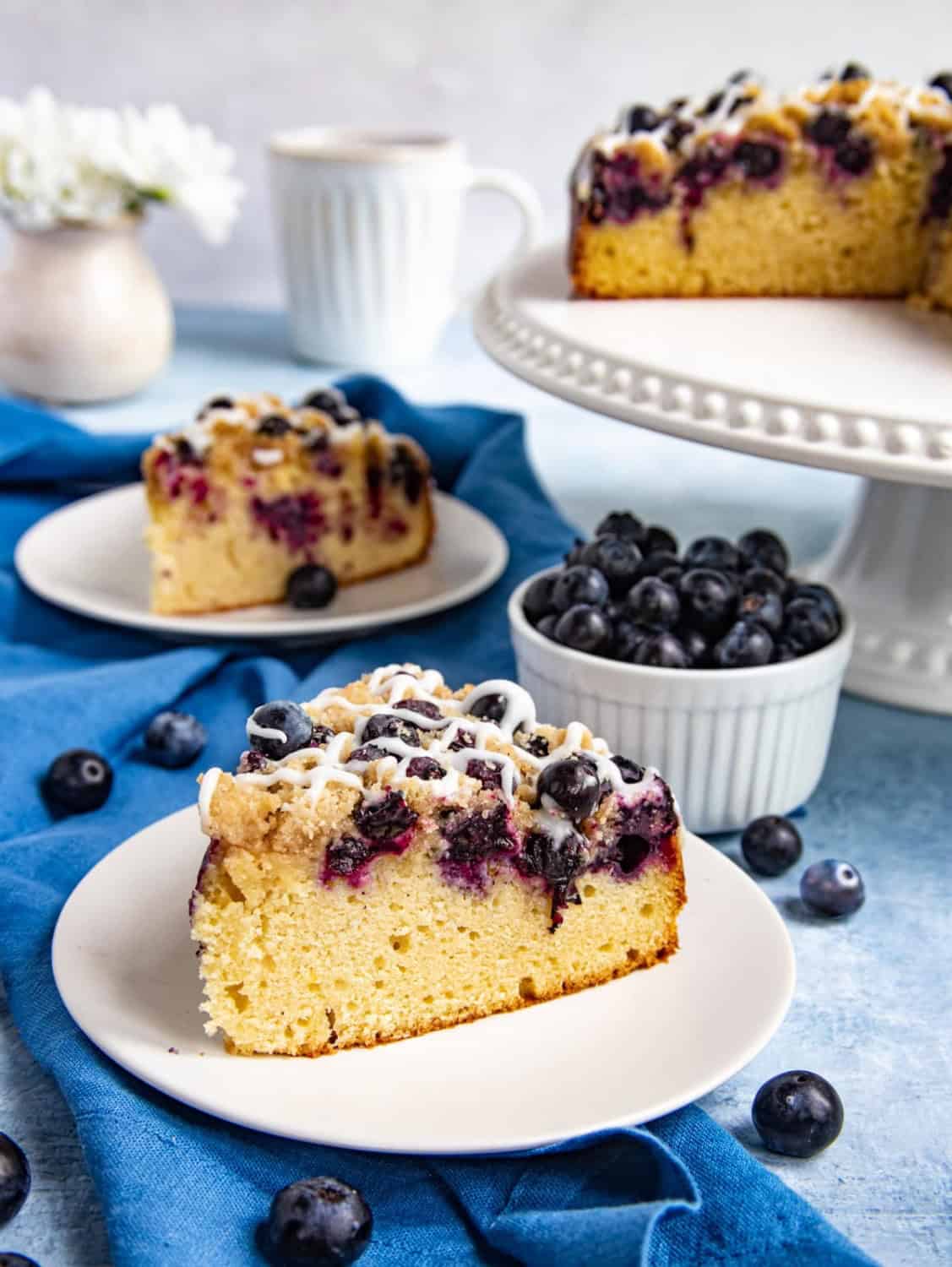 slice of blueberry coffee cake on a white plate