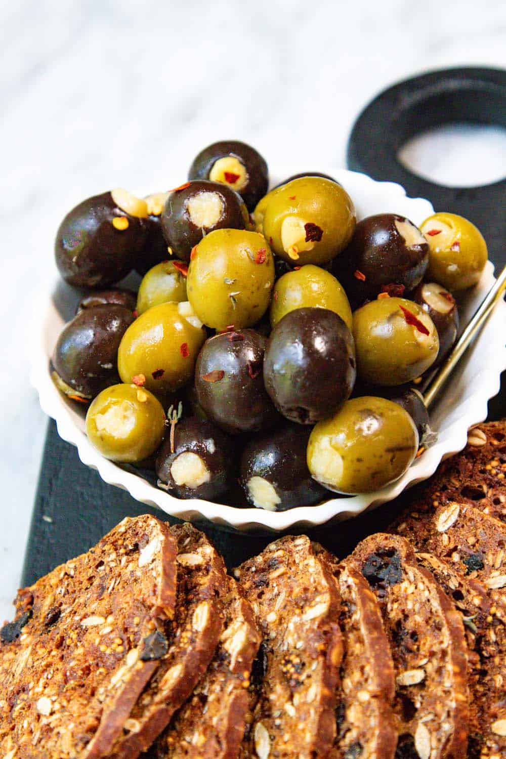 Close up of stuffed green and black olives.